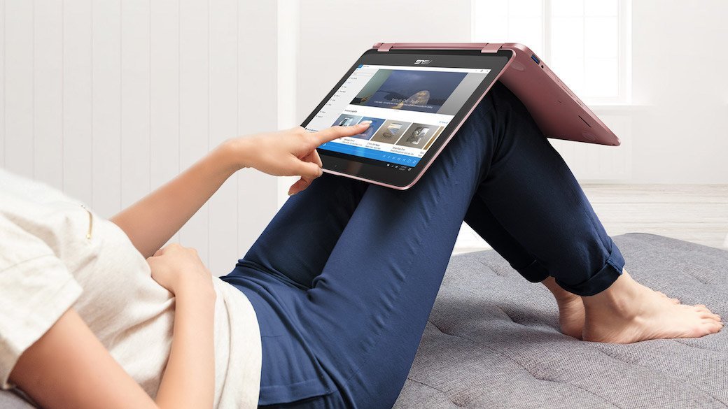 Person laying back with convertible laptop on lap