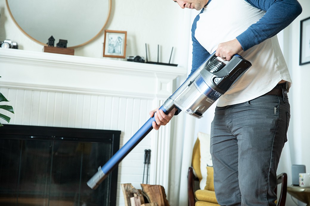 Man holding cordless handheld vacuum
