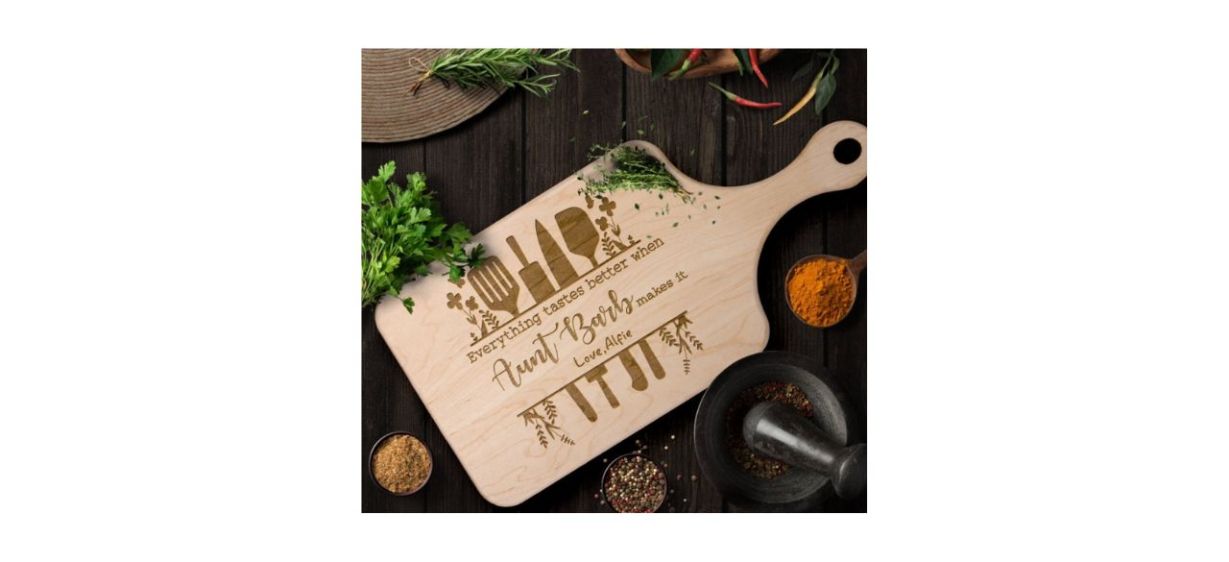 OneHappyRoad Best Aunt Cutting Board on wooden table next to spices