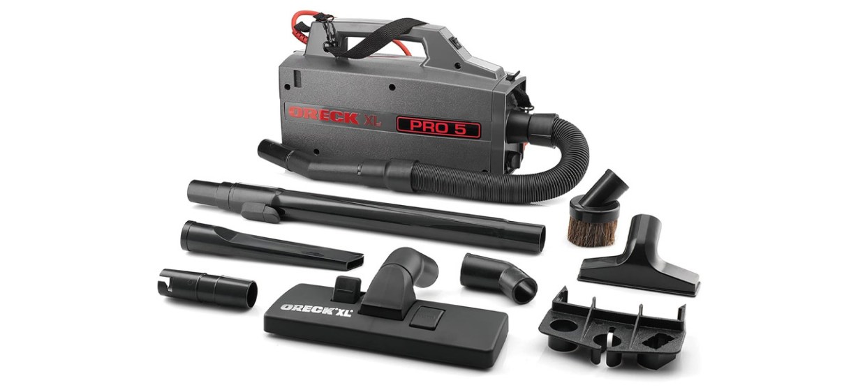 Oreck Commercial XL Pro 5 Compact Canister Vacuum with accessories on white background