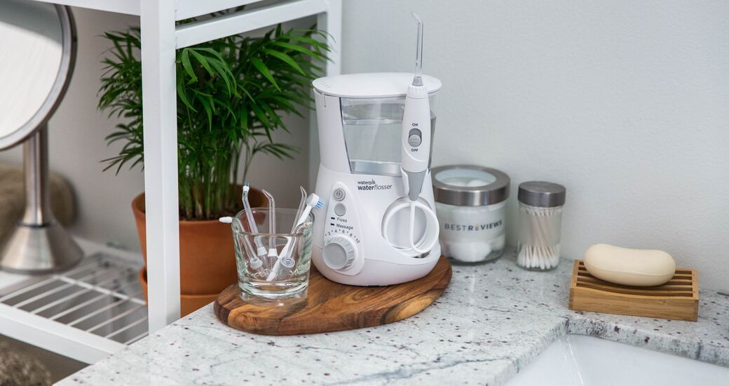 Water flosser on bathroom countertop