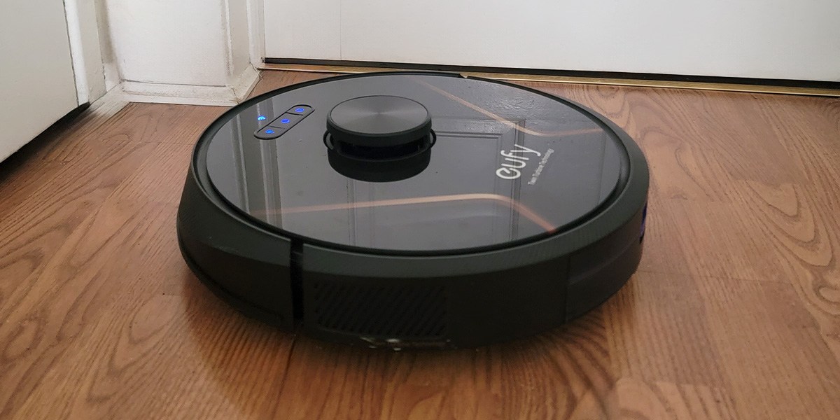 Eufy RoboVac X8 on dark-colored laminate floor