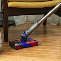 Cordless vacuum under chair
